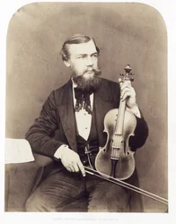Violinist seated with Stradivarius
